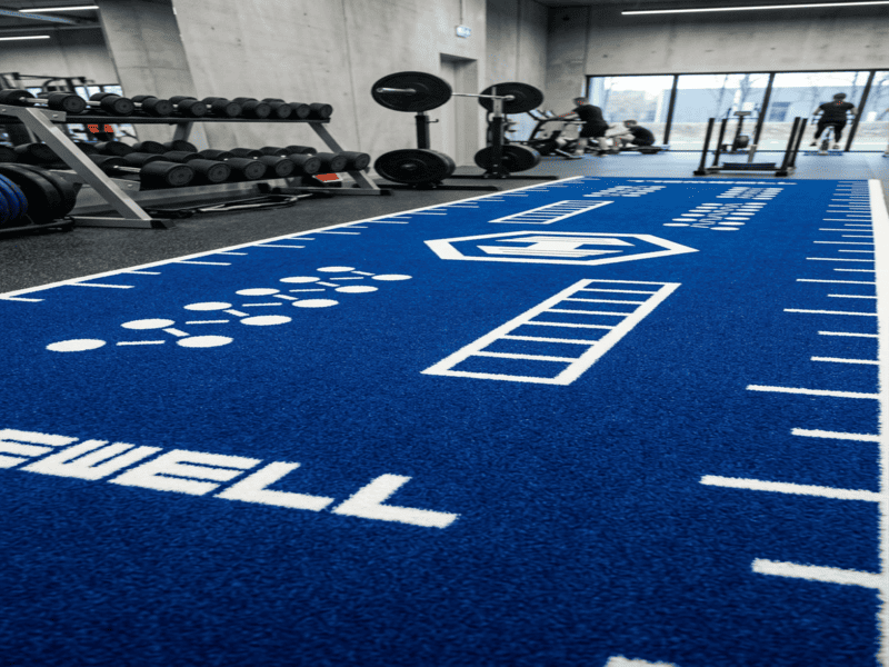 using a turf roller on gym floor